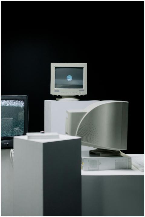 Vintage computer monitors arranged in a minimalist