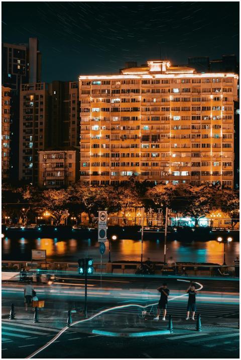Dynamic city night scene with illuminated building
