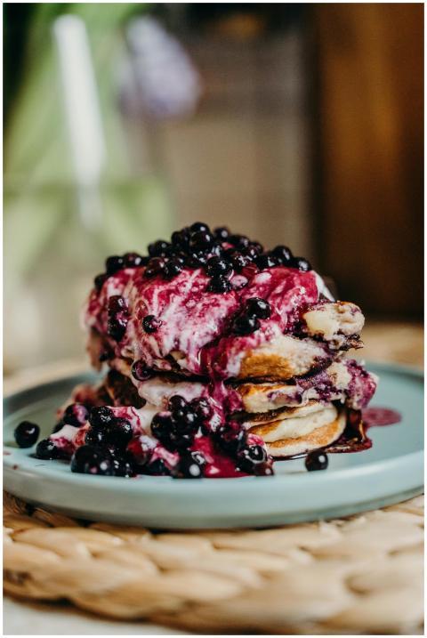 Mouthwatering stack of pancakes topped with bluebe