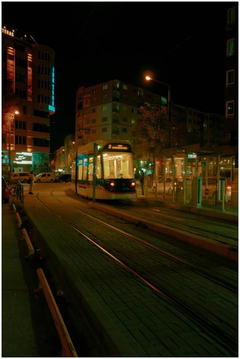 Tram navigating the lively Eskişehir city streets