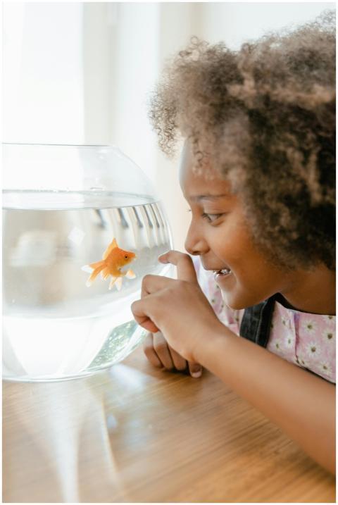 A child with curly hair joyfully interacting with