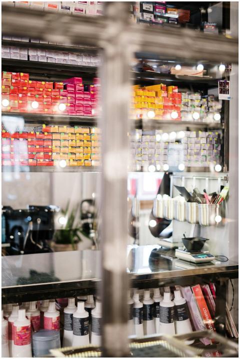 A vibrant hair salon showcasing neatly organized h