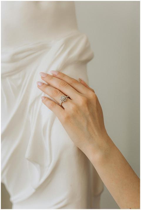 Close-up of a woman's hand with a diamond ring tou