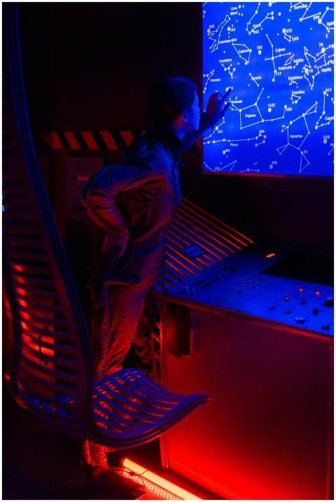 Female astronaut interacting with futuristic star