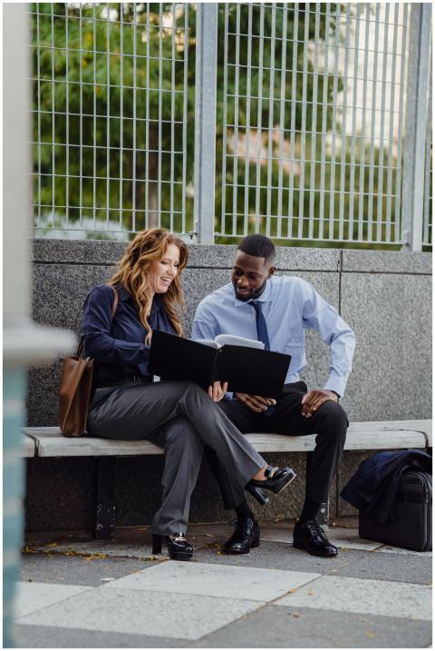 Two diverse business professionals reviewing docum
