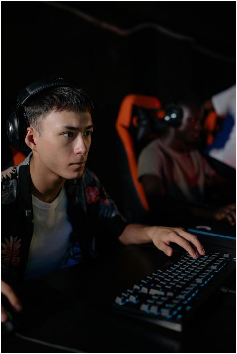 Teenagers engrossed in a competitive e-sports gami