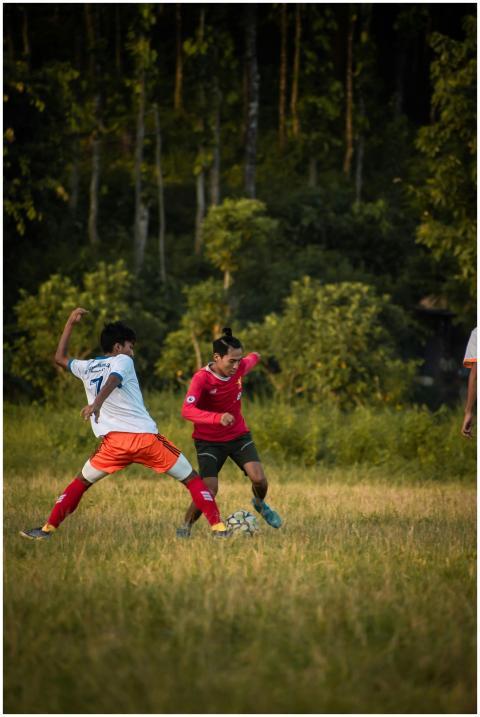 Dynamic soccer match with players competing on a l