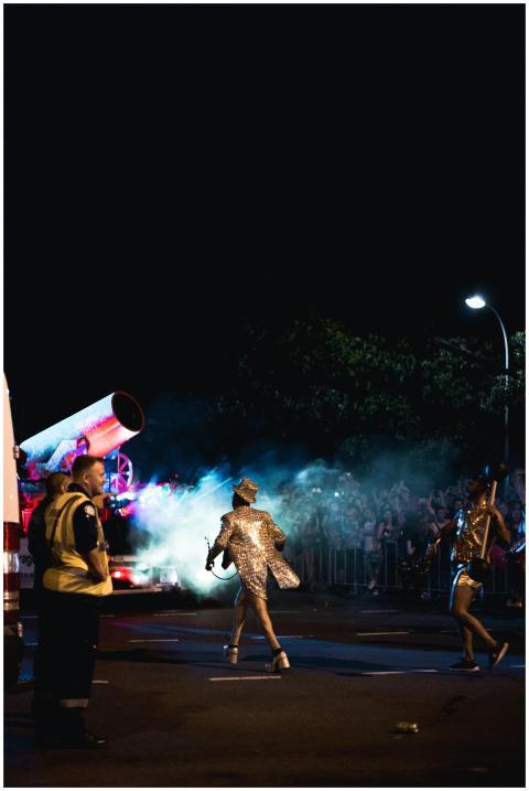 Dazzling parade performers dance in vibrant costum