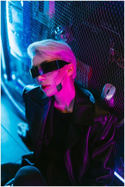 Stylish woman in cyberpunk attire with futuristic