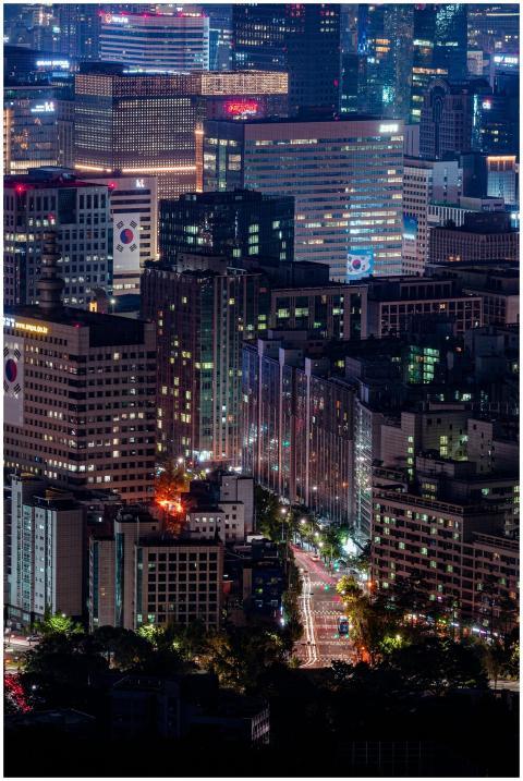A vibrant nighttime view of Seoul showcasing illum