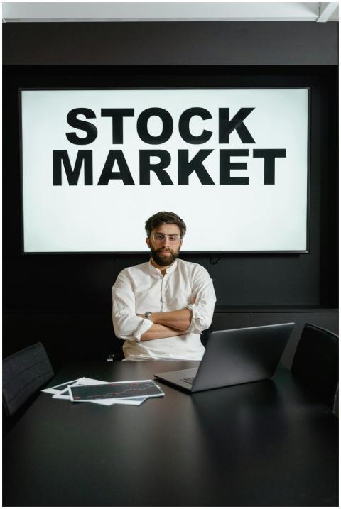 Professional businessman with arms crossed in fron