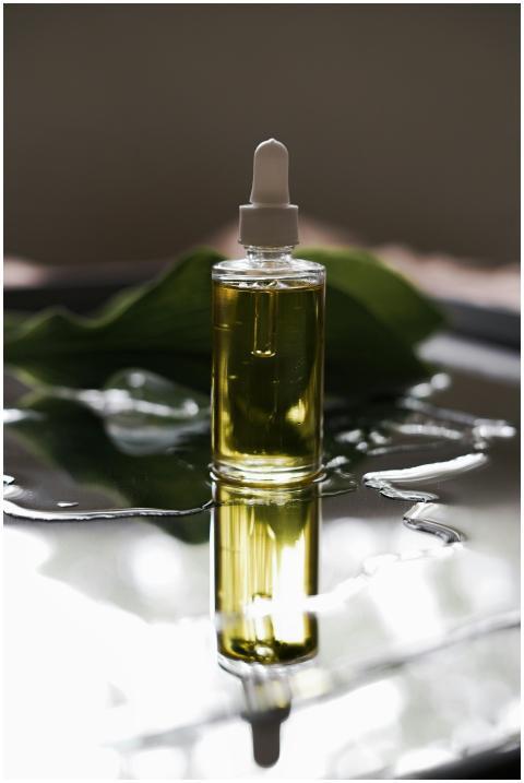 Close-up of a luxury skincare oil bottle with a dr