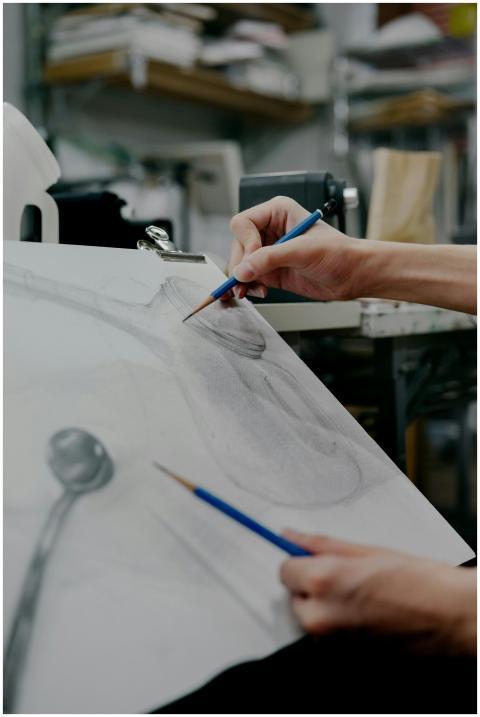 Close-up of an artist sketching in a Shinjuku stud