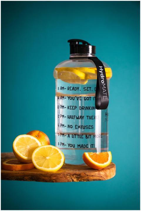 Lemon-infused water bottle with motivational text,