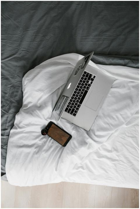 Minimalist overhead view of a laptop and smartphon