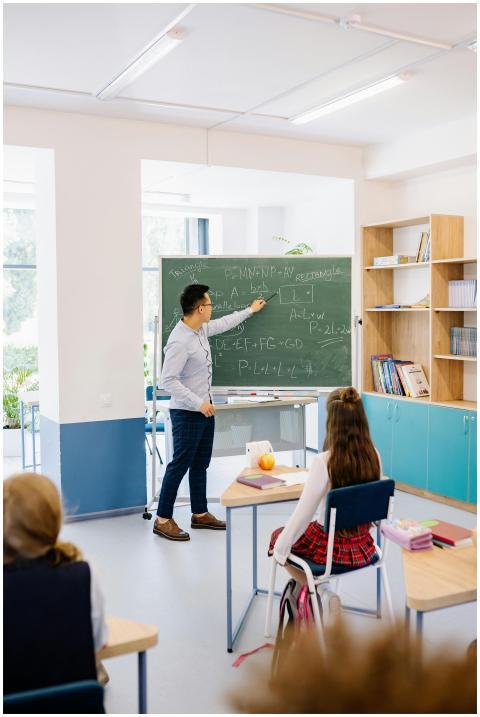 Instructor teaching students in a bright classroom