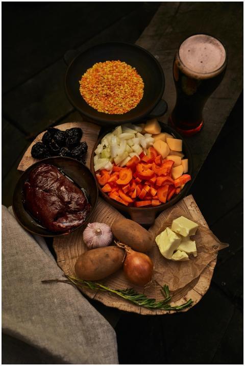A flat lay of fresh ingredients for a hearty stew,