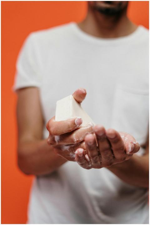 Close-up of a man washing hands with bar soap, pro