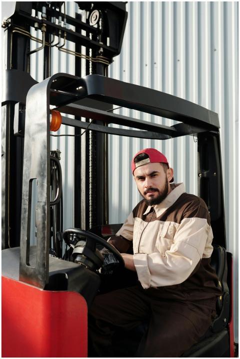 Portrait of a forklift operator inside a warehouse