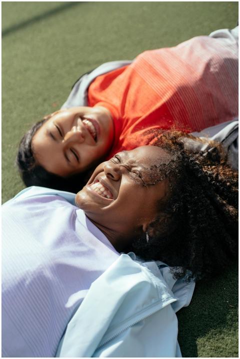 High angle of cheerful multiracial girlfriends lyi