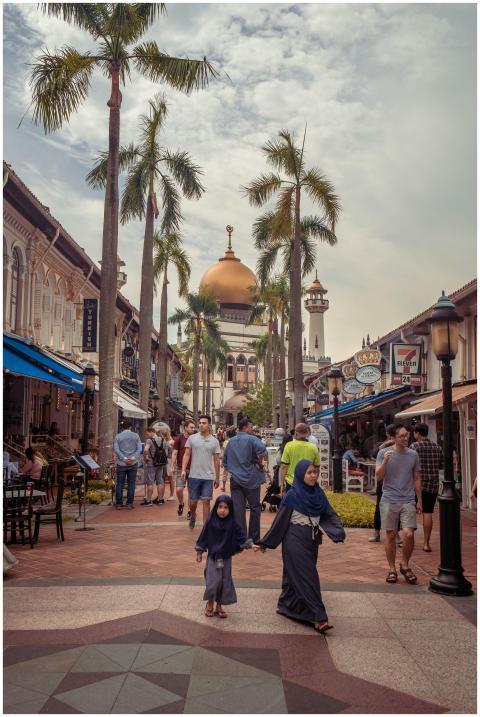Lively street scene with tourists near the iconic
