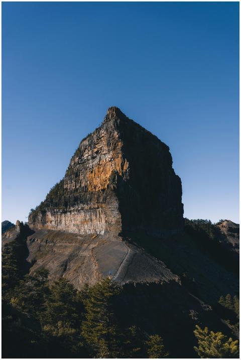 A stunning view of a rocky mountain peak under a c