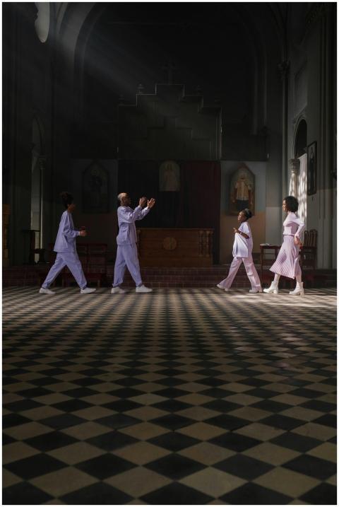 A group engaged in a performance inside a church,