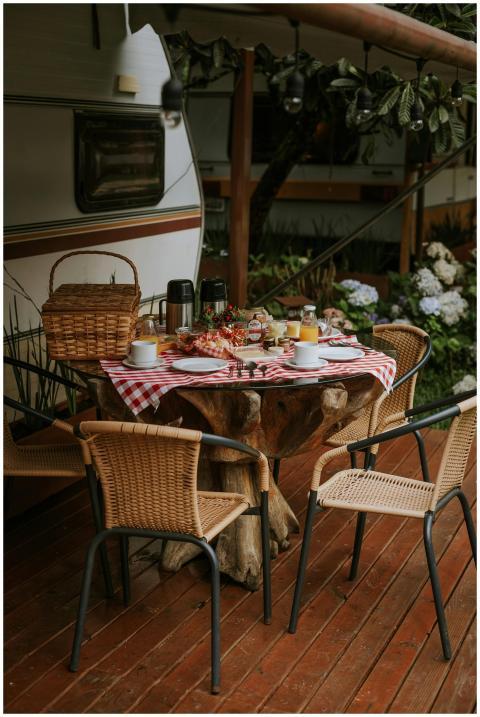 Cozy outdoor breakfast setting with wicker chairs