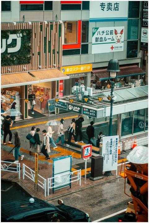 People walking near a Tokyo subway entrance on a b
