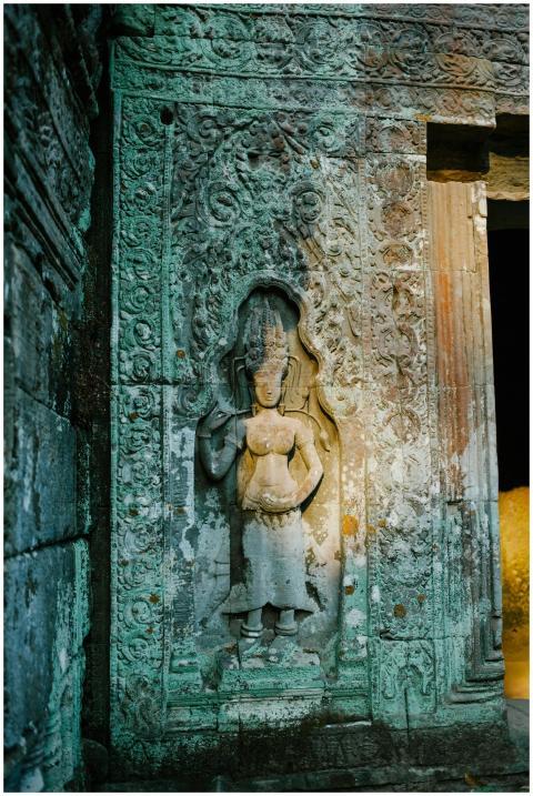 Detailed stone carvings on a wall at Angkor Wat, s