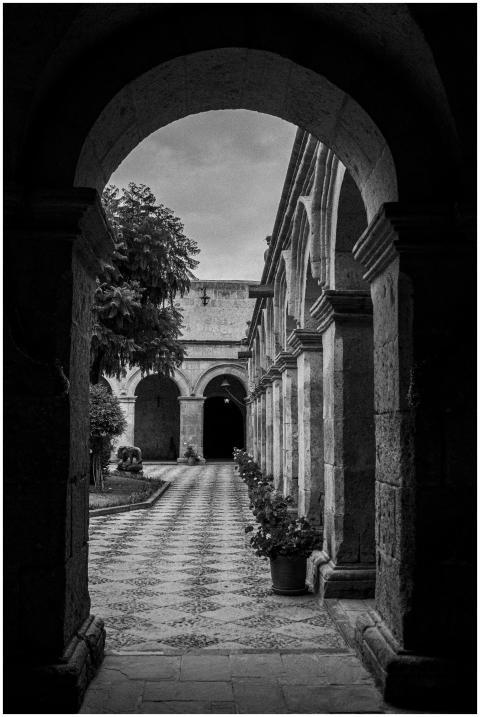 Black and white view of a historic monastery court