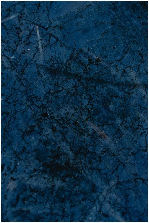 Close-up of a frozen blue surface with natural abs