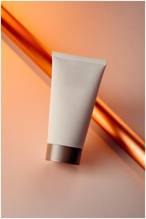Close-up of a skincare cream tube with a modern gr