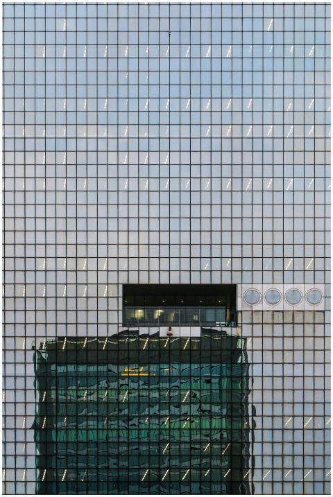 Glass facade of a skyscraper in Osaka, Japan, refl