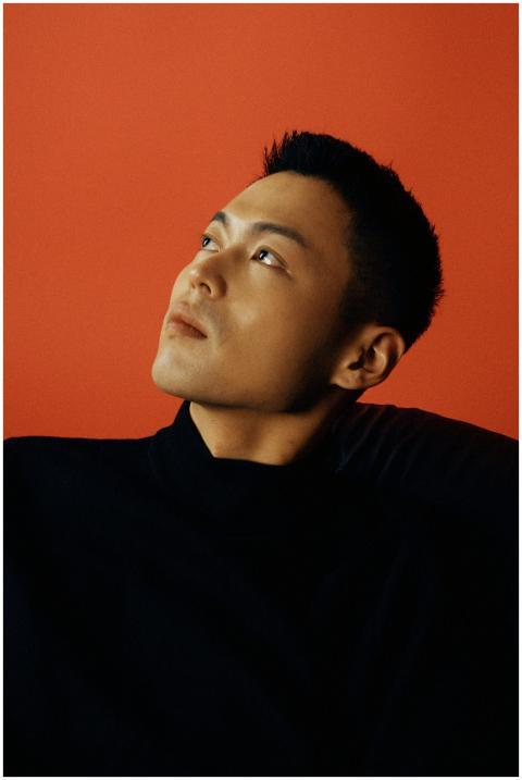 Stylish portrait of a man looking thoughtfully upw