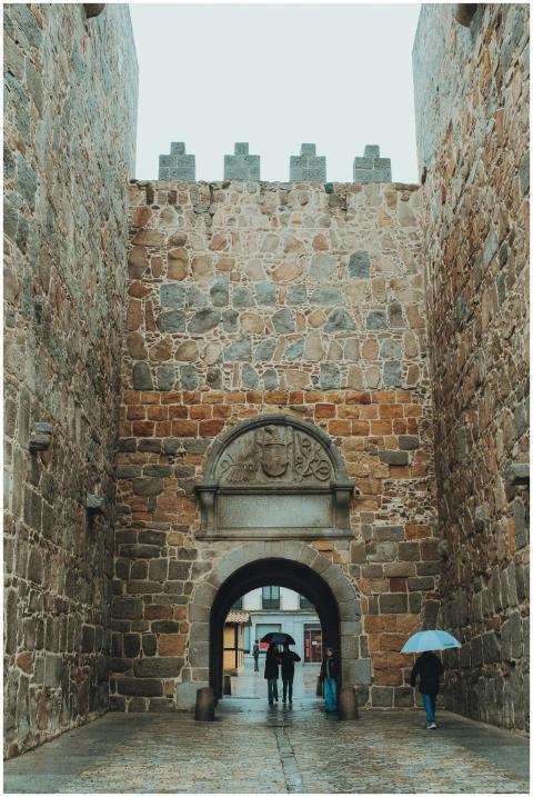 Stone fortress walls with archway in Ávila, Spain,