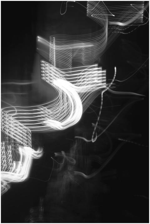 Black and white abstract image featuring dynamic l