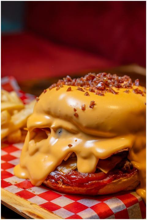 Mouthwatering cheeseburger oozing with melted chee