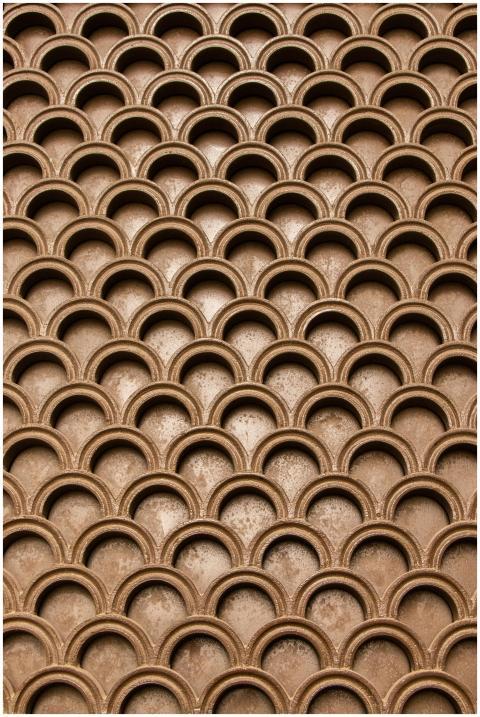 Intricate brown geometric pattern creating an abst