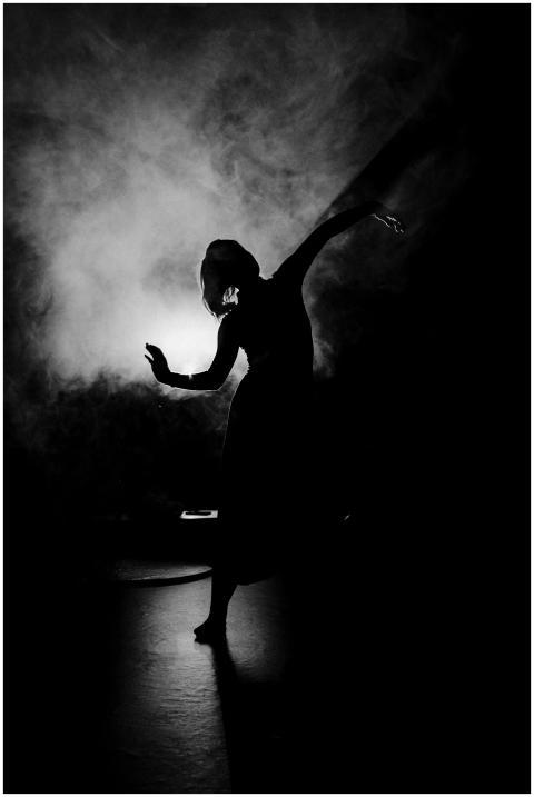 Black and white silhouette of a woman dancer perfo