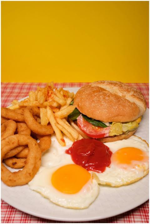 Mouthwatering breakfast plate featuring a burger,