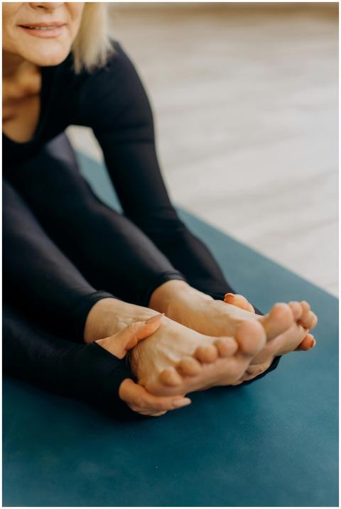 Close-up of a woman stretching her legs and feet d