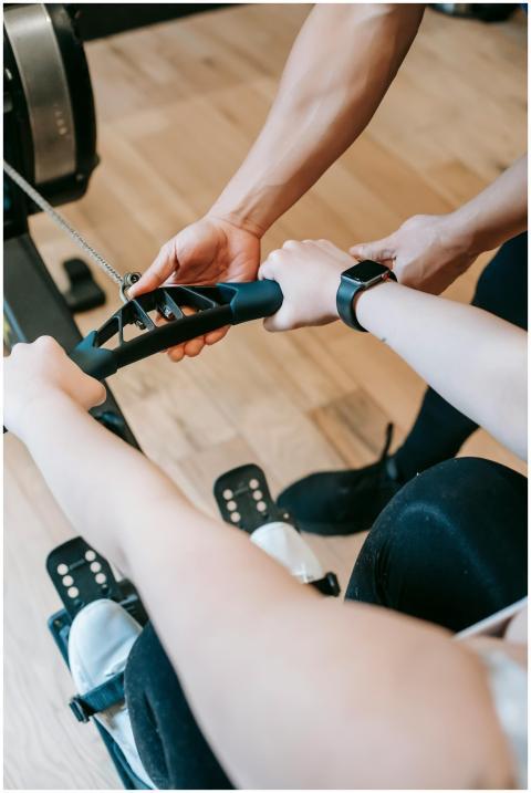 Close-up of a personal trainer guiding a client on