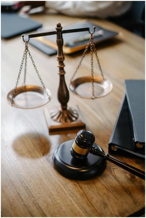 A striking image featuring a brass justice scale a