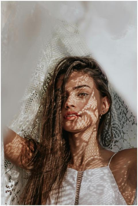 Artistic portrait of a young woman with intriguing