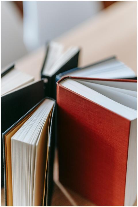 High angle of set of various books placed on woode