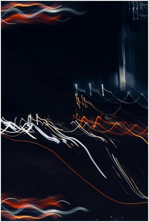 Vibrant abstract light trails against a dark night