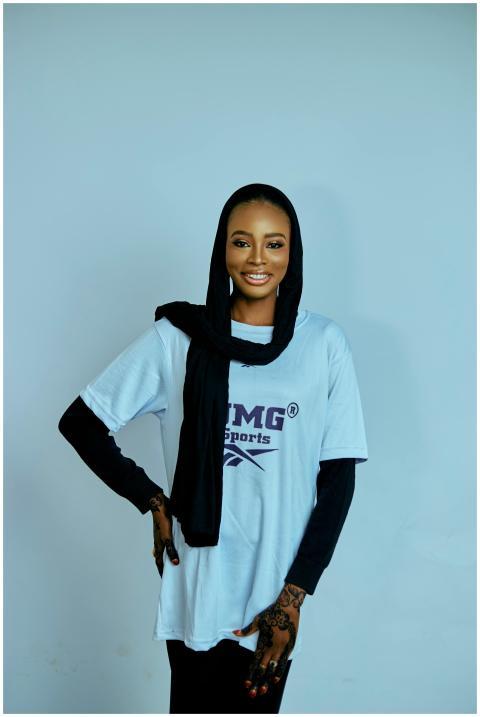 Confident woman in hijab wearing a TMG sports t-sh