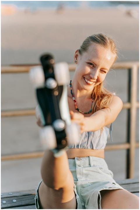Happy woman enjoying a summer day at the beach wit