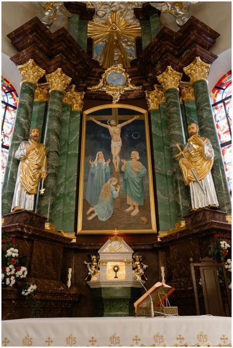 Elaborate altar in a cathedral featuring religious